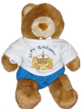 stuffed teddy  bear toy that says Happy birthday.